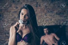 Cropped Close Up Photo Of Attractive, Sensual, Erotic, Tempting, Desirable,  Alluring, Sexual, Graceful, Woman Dressed In Purple Bra, She Is Holding A  Silver Pack With Preservative Stock Photo, Picture And Royalty Free