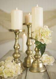 Display your favorite flameless candles with a touch of elegant style using gold & black metal candle holder! Athen Gold Candlestick Eclat Decor Pillar Candle Holders Pedestal Candle Holder Pillar Candle Centerpieces