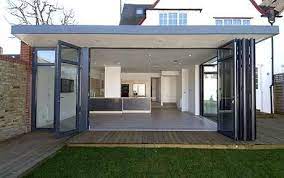 Because the new extension extends beyond the existing width of the house, the glass extension is going into a relationship with the existing annex. Cambridge Network