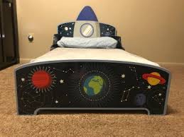 You have two toddler bed options: Delta Children Space Adventures Rocket Ship Wood Toddler Bed Walmart Com Walmart Com