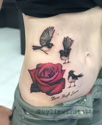 Small Bird And Rose Tattoo Cute Little Willie Wagtail Birds With Pink And Red Rose On Ribs And Stomach Tattoo By Kylie Heslop Tattoo Power Lyneham Tattoo Artists Wagtail Tattoo Tattoos