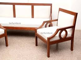 Teak wood sofa set with very fine carving pattern and very comfortable with traditional rajasthani look which makes this sofa design one of the most ordered and selling sofa of our collection. Sleek Wooden Sofa Set With Fixed Cushion Handmade Teak Furniture