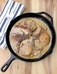 Baked Pork Chops With Cream Of Mushroom Soup In A Cast Iron Skillet Baked Pork Pork Chop Recipes Baked Baked Pork Chops