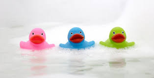 Bath time and rubber duck in soap foam. Indivstock