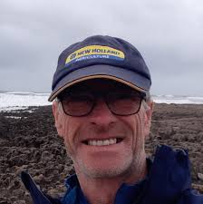 What is the cause of a crackling sound from the front windshield area while  driving at high speeds?