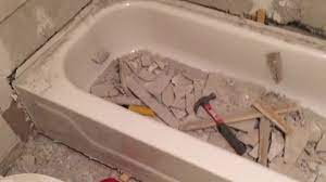 In this video, learn how to remove an old bath tub with plumber mike lombard with nothing more than a reciprocating saw, a screwdriver, and a moving blanket. How To Remove A Steel Bathtub Youtube
