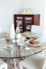 Use a small bit of twine to hold the sprigs in place, then enjoy the way the smell fills your dining room as the leaves dry out. Our Everyday Dishes A Mini Dining Room Tour Glass Dining Table Decor Dinner Table Decor Dining Table Decor Everyday