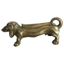 Well, for one they can be quite expensive if you don't shop around. Brass Dachshund Dog Boot Scraper Door Stop At 1stdibs