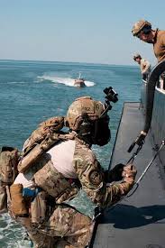 us coast guard msrt practicing hook and ladder climb on a