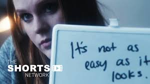 A hearing-impaired woman begins learning sign language.