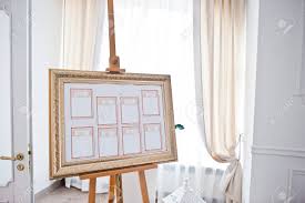 wedding seating chart on the easel at light restaurant