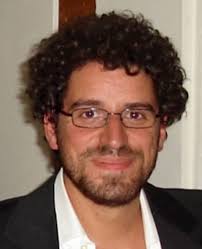 On the formation of inclusion complexes at the solid/liquid interface of  anchored temperature-responsive PNIPAAM diblock copolym