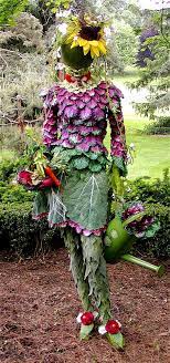 This Life Size Mannequin Was Embellished With Faux Kale Cabbage Leaves And Other Bits From Nature To Create This Garde Garden Art Garden Design Garden Whimsy