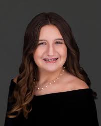 Introduction of miss batte as symphony league belle