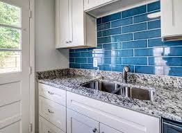 Dark gray lower cabinets with a speckled black countertop keep this kitchen sleek and sophisticated. Google Image Result For Https Designingidea Com Wp Content Uploads 2018 04 K Backsplash For White Cabinets White Kitchen Design White Tile Kitchen Backsplash