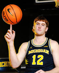 New Zealand teenager Oscar Goodman has won the NCAA basketball title with  the Michigan Wolverines.