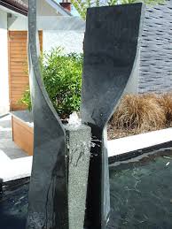 Watering can garden water features. 18 Snazzy Modern Water Features For Your Garden Homify