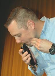 Mike Menchyk, a teacher at the Butler Senior High School, enjoys one last  moment with his impressive beard before shaving it off as a result of the  “Save It or Shave It?”