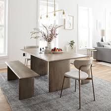 If you prefer a subdued color scheme, a slate table will coordinate beautifully with ivory and beige decor. Anton Solid Wood Dining Table Graywashed