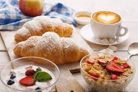 What food do french people usually eat for breakfast? Traditional French Breakfast Menu Closeup Yogurt With Fresh Berries Cup Of Coffee Muesli And Croissants On Wooden Table Stock Photo Picture And Royalty Free Image Image 88153546