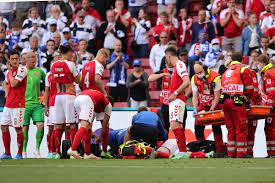 Eriksen appeared to stumble to the ground in clear distress. Eriksen Falls Lifeless On The Lawn Denmark Finland Suspended Sports Prime Time Zone