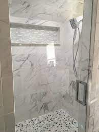 Marble tiles with an onyx wall slab. Finding Tile For A Bathroom Remodel With A Masculine Look Tile Outlets Of America