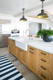 Check spelling or type a new query. Black Barn Lanterns Hang From A White Shiplap Ceiling Over A Caramel Stained Island Accented Wit Maple Kitchen Cabinets Kitchen Renovation Oak Kitchen Cabinets