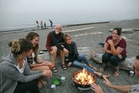 Pg&amp;e will spend up to $30 billion burying. Multi Generational Family Hanging Out Together Around Fire On The Beach By Rob And Julia Campbell