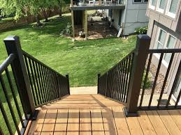 This is a deck i built in ledyard connecticut and the important part i would like to point out is the blocking under the rails. Westbury Black Railing With 4x4 Posts And 2x2 Crossover Stair Railing Stair Railing 4x4 Post Black Railing
