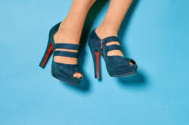 Nike, clarks, barbour, anne klein, michael kors Close Up View Of Woman Legs In High Heels Shoes Against Blue Background Creative Commons Bilder