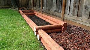 There Is A Wide Variety Of Composite Landscaping Timber Products On The Market Most Look Like Wood Can Be Landscape Timbers Landscape Timber Edging Backyard