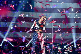 Cyrus performed a medley of most notable hits and newest singles, such as prisoner, edge of midnight. Miley Cyrus Wore Skintight Leather Pants A Feathery Mini Dress