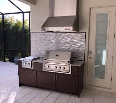 brown outdoor kitchen with backsplash