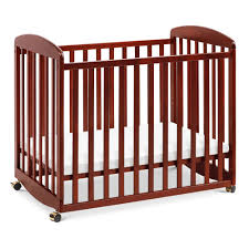 Davinci Alpha Mini Rocking Crib Cherry In 2020 Mini Crib Cribs Baby Cribs