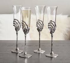 With this cool and useful thing. Skeleton Hand Champagne Glass Pottery Barn