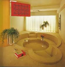 In this shot, spotted on interiors digital, it definitely looks worth curling up in — and it's big enough for a crowd. Conversation Pits And Sunken Baths Retro Interior Design 70s Interior Design 70s Interior