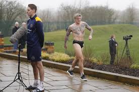 Sky Sports News viewers in hysterics as Shrewsbury ace Jason Cummings walks  past camera during live interview naked