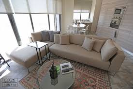 Exploring Different Textures Of Same Spirit The Jordanian Stone With A Modern Open Layout Interior Design Sectional Couch Home Decor