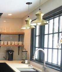 There used to be a light fixture over the kitchen sink shining straight down. How To Light Up The Kitchen Sink With Style Inspiration Barn Light Electric