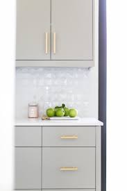 Light Gray Flat Front Butler Pantry Cabinets Are Fitted With Lewis Dolan Bar Pulls And A White Quartz Light Grey Kitchens Kitchen Cabinets Flat Panel Cabinets