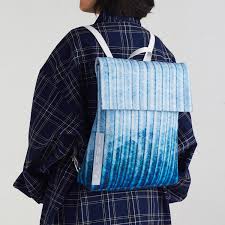 What is this message about? Tomii Backpack Tote Bag Handbag Artworklabbkk