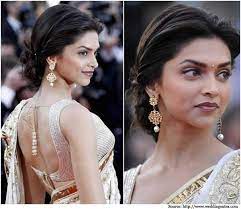 A Low Twisted Bun Hairstyles For Women Hairstyles Hair Puff Bollywood Hairstyles Deepika Padukone Hair