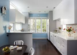 Chic kitchen features blue cabinets adorned with gold pulls paired with white marble countertops and matching backsplash. Best 10 Color Pairs For The New Year Light Blue Kitchens Blue Kitchen Walls Grey Kitchen Cabinets
