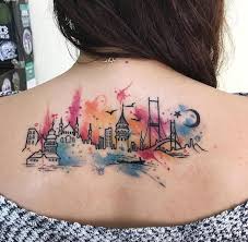 Black And White Watercolor Tattoo City Skyline Back Watercolor Lion Tattoo Brown Hair Black White Sweater In 2020 Tattoos Tattoos For Daughters Watercolor Tattoo