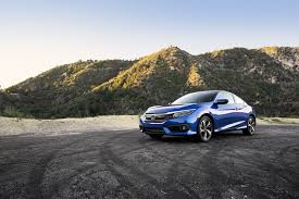 Admire The Curves The Honda Civic Coupe Matches The Mountains With Its Redesigned All New Aggressive Styling Civic Coupe Honda Civic Coupe Honda Civic Vtec