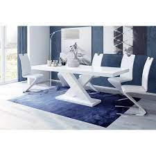 Collection of monolithic low tables which can be realized totally in lacquer or with base and under top in lacquer and top in marble. Leon Extendable Dining Table Overstock 26268648