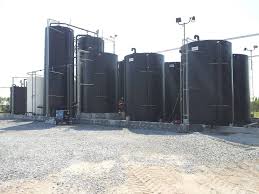 Houston PolyTank skirted cone bottom tank for high-temp chemicals, specified by James Riggins.