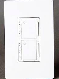A double light switch plate screwed into the wall. All About Combination Switches And Receptacles Better Homes Gardens