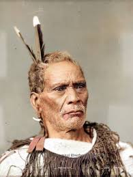 Taketake Rangitupu**, of Ranana, Whanganui, wearing a korowai (tag cloak)  and huia feathers, photographed ca 1903 by W H Partington of Whanganui.  (information