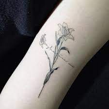 Marvelous feminine guitar silhouette with flowers tattoo on upper arm for girls. Cross Tattoos For Women Ideas And Designs For Girls